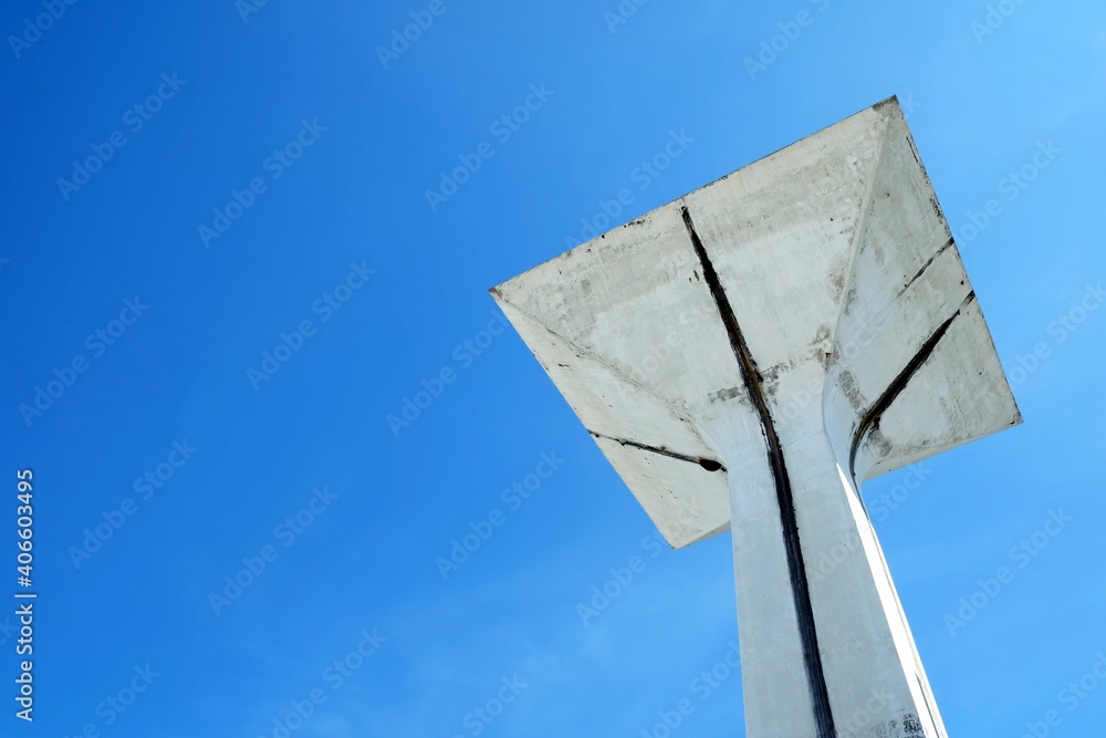 White Concrete Hall with Blue Sky Background in Font of TU Gymnasium 5 at Thammasat University Stadium Rangsit campus, Bangkok Thailand. White Concrete Hall with Blue Sky Background in Font of TU Gymnasium 5 at Thammasat University Stadium Rangsit campus, Bangkok Thailand.