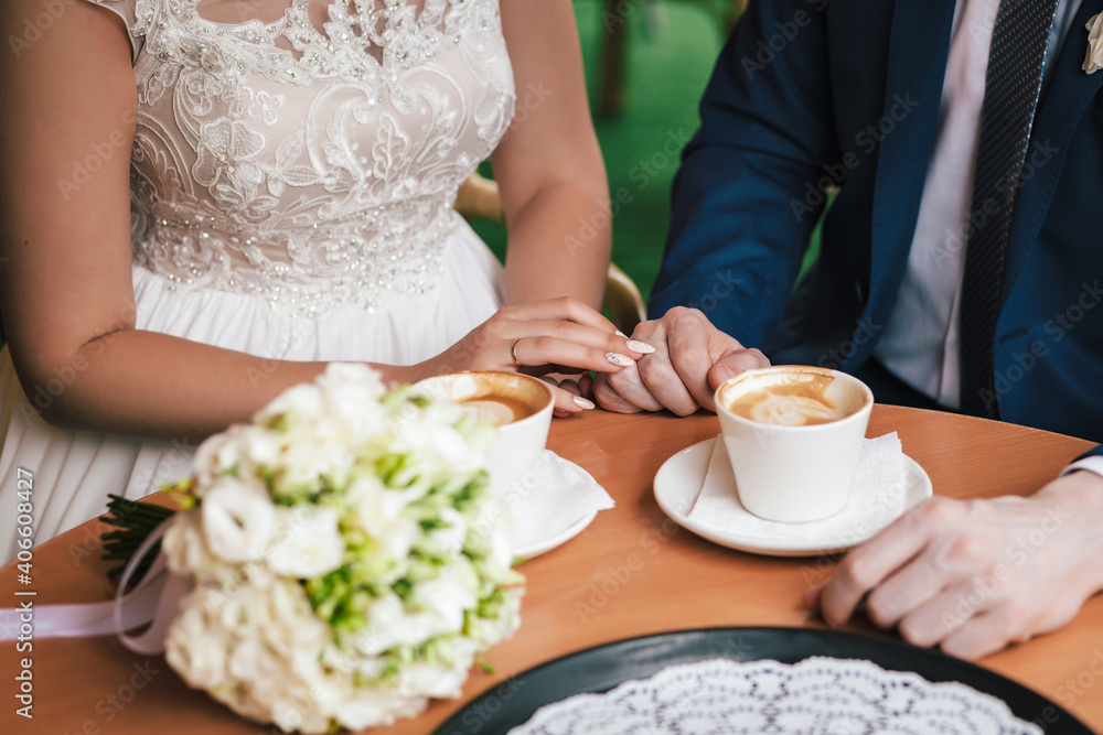Lovers touch each other with a cup of coffee Lovers touch each other with a cup of coffee