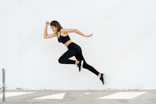 Dynamic movement. Woman runner isolated on white. Sporty runner in fashionable sportswear. Fitness run sport motivation. Strong and fit. Athletic woman sprinter or runner.