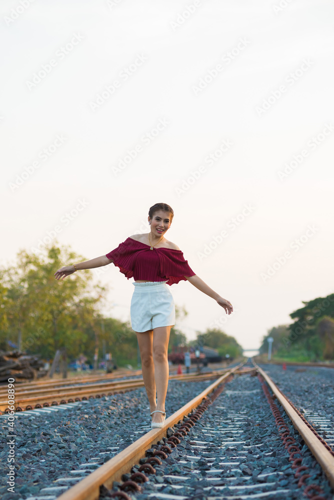 Sexy girl walking on rails