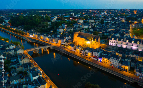 Laval city and Mayenne river in the evening. View from above. France