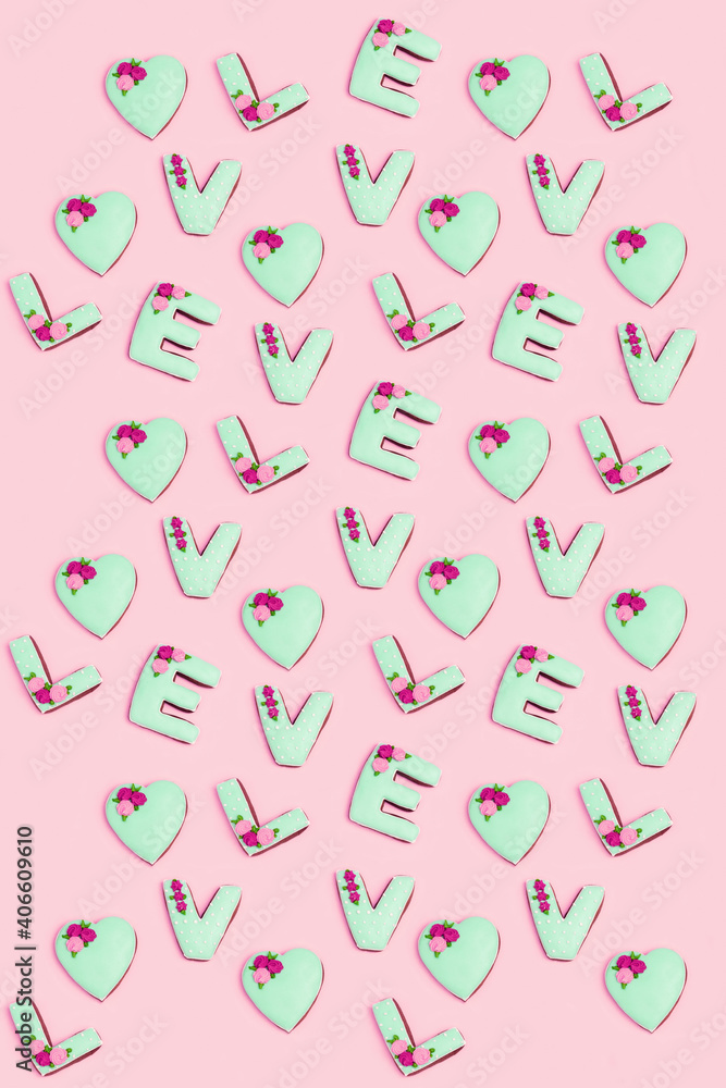 Regular pattern from homemade gingerbreads with letters love. Saint Valentine day texture. Holiday food concept.