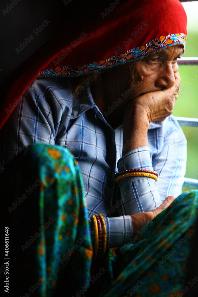 Old Indian women traveling in train alone.