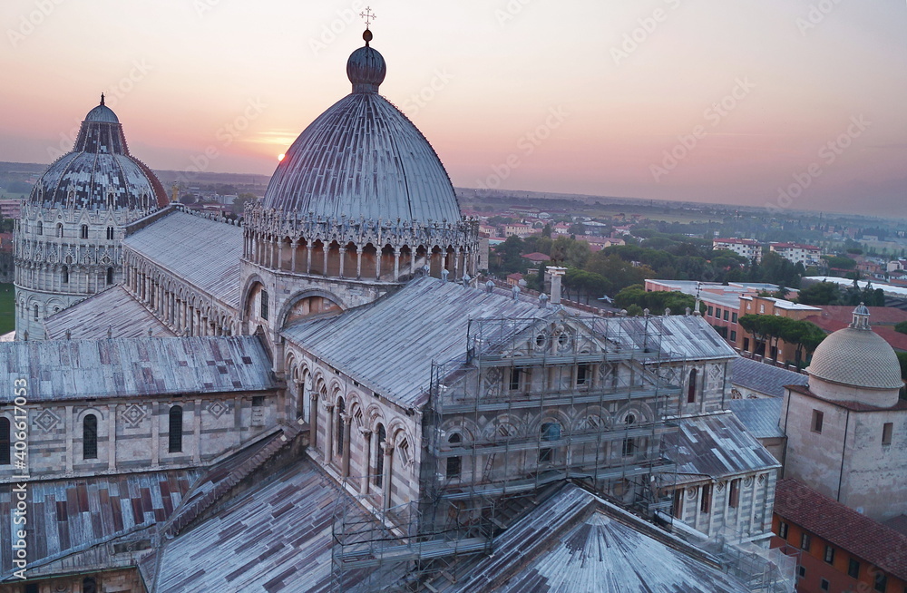 View of the cathedral and baptistery of Pisa from the leaning tower at sunset, Tuscany, Italy