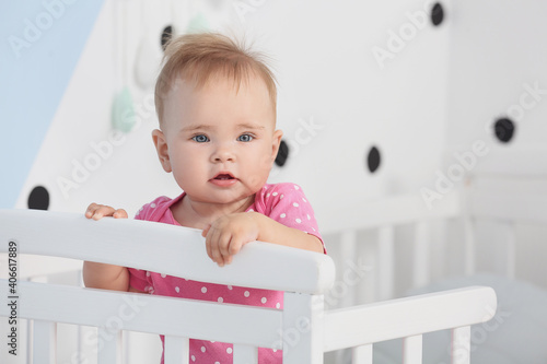 Cute little baby standing i...