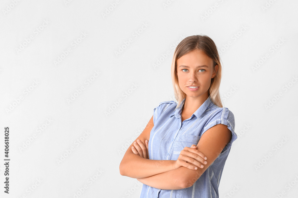 Portrait of beautiful young woman on light background Portrait of beautiful young woman on light background