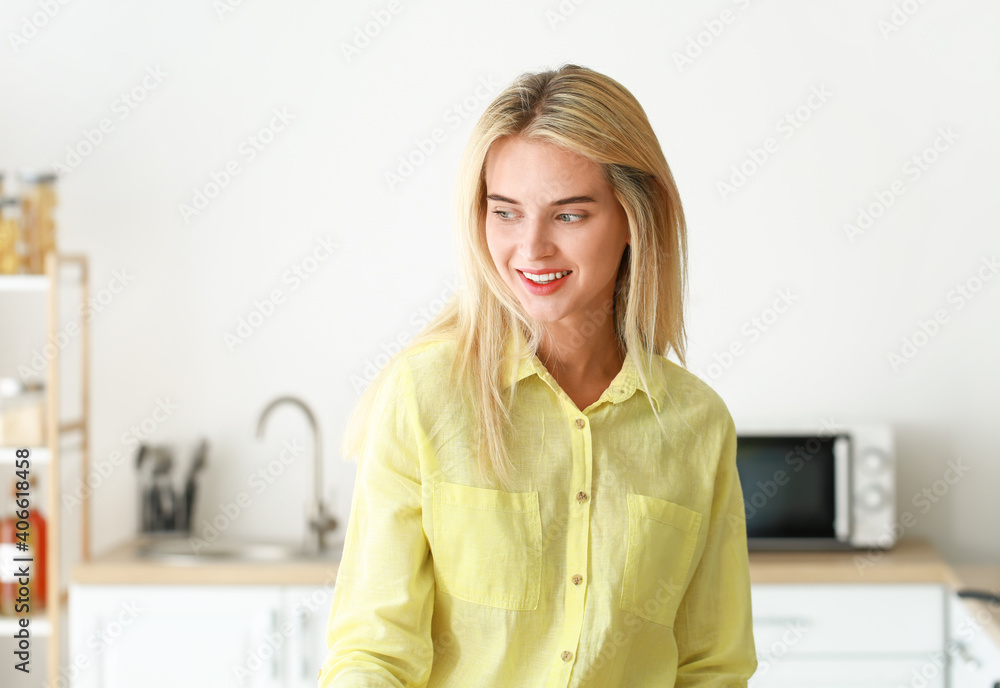 Beautiful young woman in kitchen at home Beautiful young woman in kitchen at home