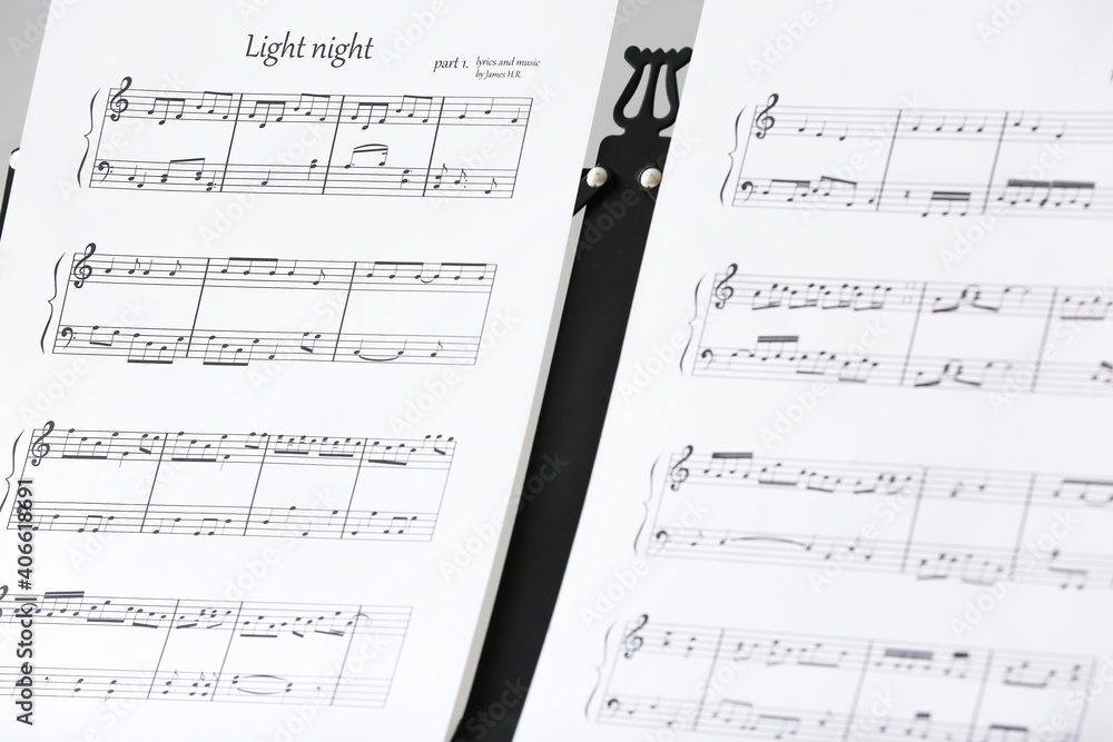 Note stand with music sheets, closeup Note stand with music sheets, closeup