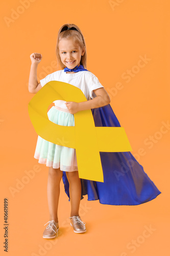 Little girl wearing superhe...