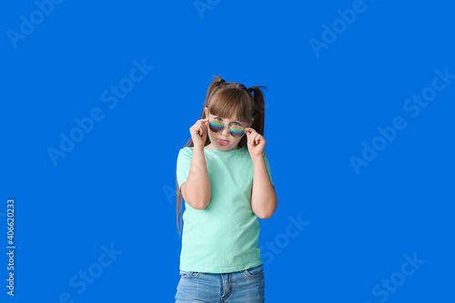 Funny little girl with styl...