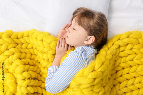 Little girl with warm plaid...