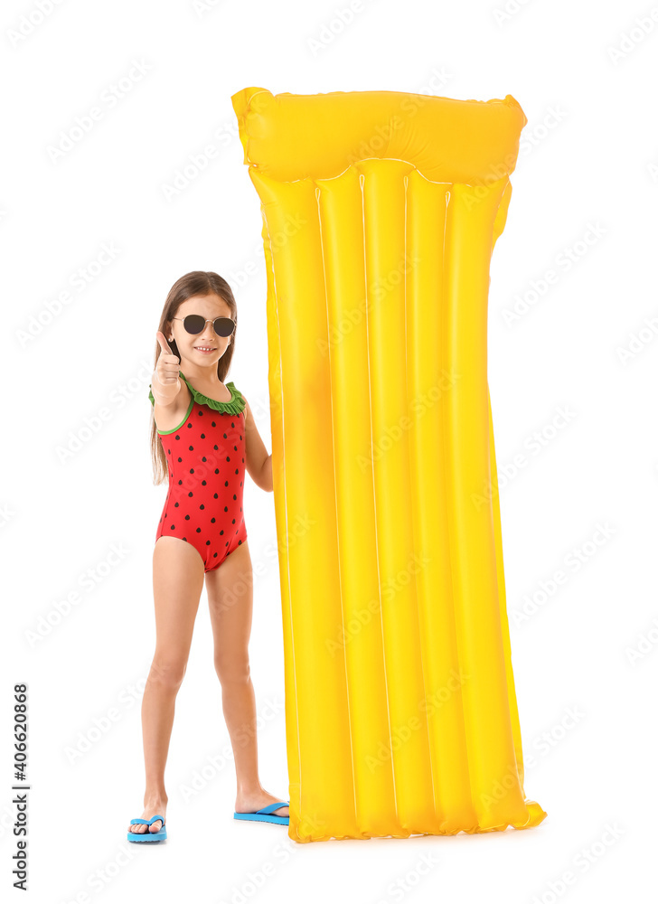 Obraz premium Cute little girl with inflatable mattress showing thumb-up gesture on white background