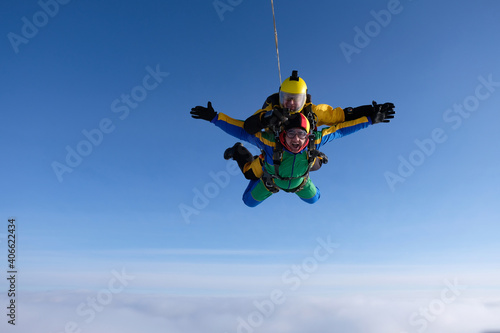 Fototapeta Naklejka Na Ścianę i Meble -  Skydiving. Tandem jump. Two guys are flying in the sky.