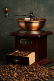 a cup of coffee and a coffee grinder