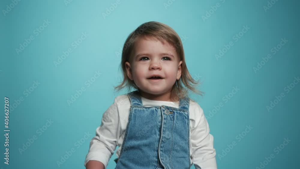 Close-up Portrait Smiling Little Girl Kid Looking at Camera. Funny Playful Laugh of Little Cute Girl Child. Expressive Cheerful Adorable Kids Face. Concept of a Fun Childhood. Laughing Toddler Shot 4k Close-up Portrait Smiling Little Girl Kid Looking at Camera. Funny Playful Laugh of Little Cute Girl Child. Expressive Cheerful Adorable Kids Face. Concept of a Fun Childhood. Laughing Toddler Shot 4k