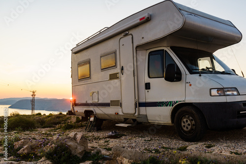 Caravan on coast at sunset, Spain