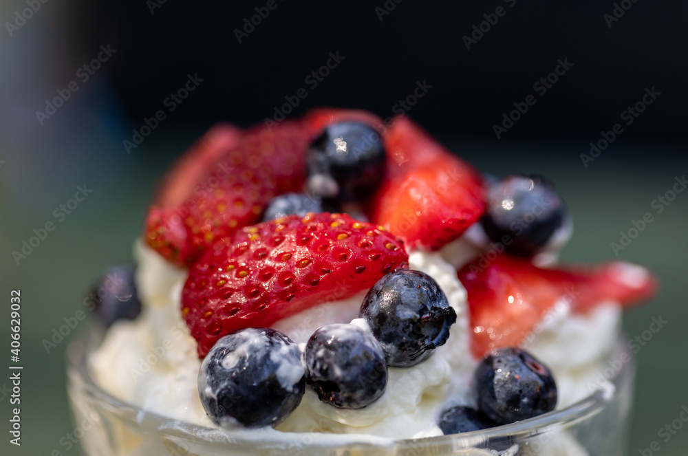 Sweet dessert - meringue with strawberries and blueberries Sweet dessert - meringue with strawberries and blueberries