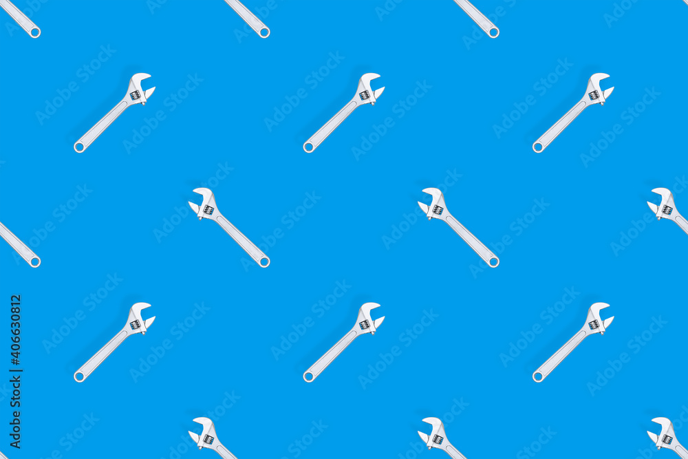 Adjustable metal wrench seamless pattern. Adjustable metal wrench on a colored background. Adjustable metal wrench seamless pattern. Adjustable metal wrench on a colored background.