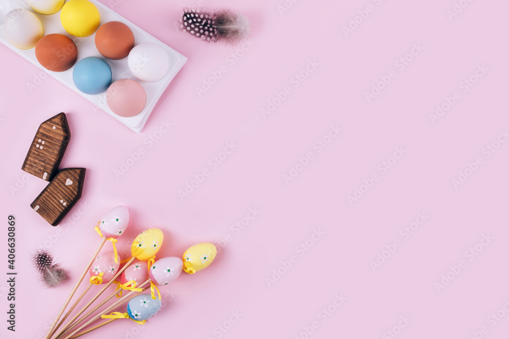 Colorful Easter eggs over pink background.