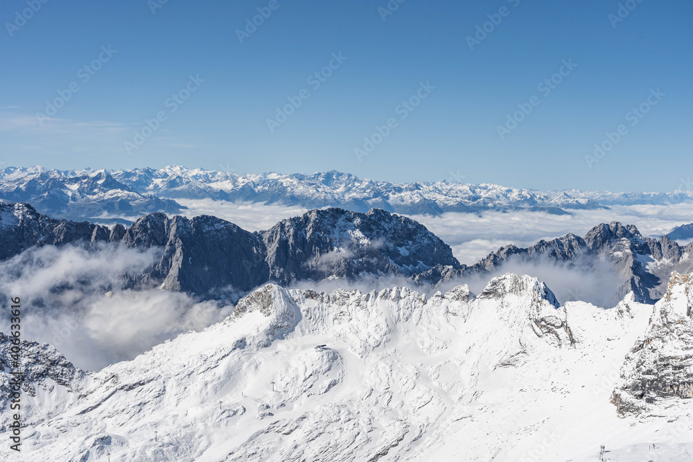 Fototapeta premium Snow mountain view in summer from Top of Germany Zugspitze view point