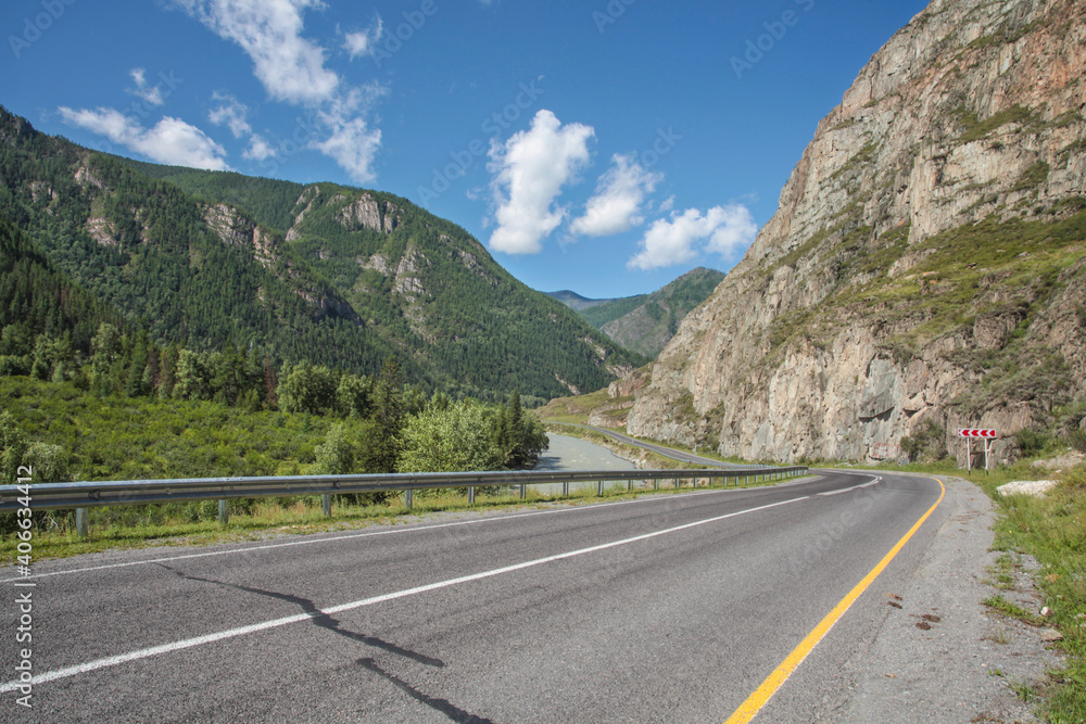 Summer view. Asphalt road passes through the gorge, Chuiski tract, Altay. 