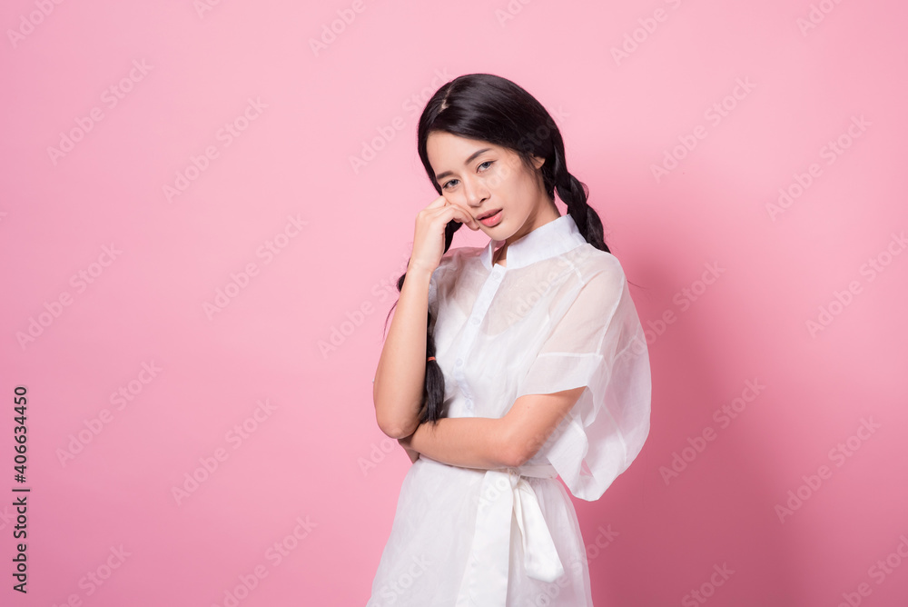 Happy cheerful young woman wearing her black hair rejoicing at positive news or birthday gift, looking at camera with joyful and charming smile. Asian girl portrait on pink background in studio Happy cheerful young woman wearing her black hair rejoicing at positive news or birthday gift, looking at camera with joyful and charming smile. Asian girl portrait on pink background in studio