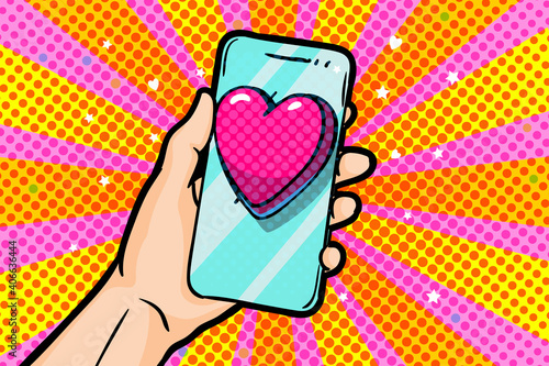 Sending love message in pop art style. Hand holding phone with love heart on screen.