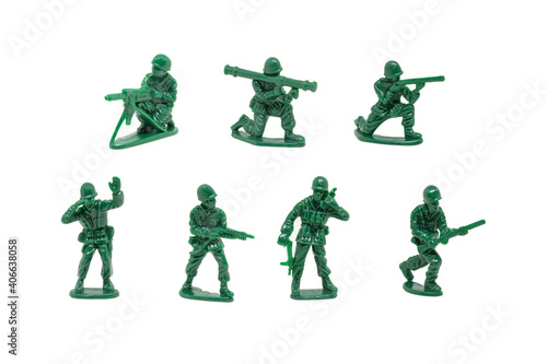 miniature toy soldiers with guns on white background © treerasak