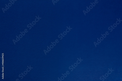 Dark blue paper background, blank, top view.