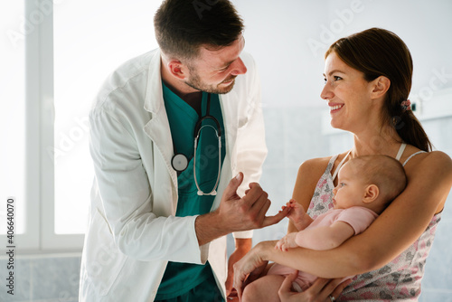 Wallpaper Mural Pediatric doctor exams little baby. Health care, medical examination, people concept Torontodigital.ca