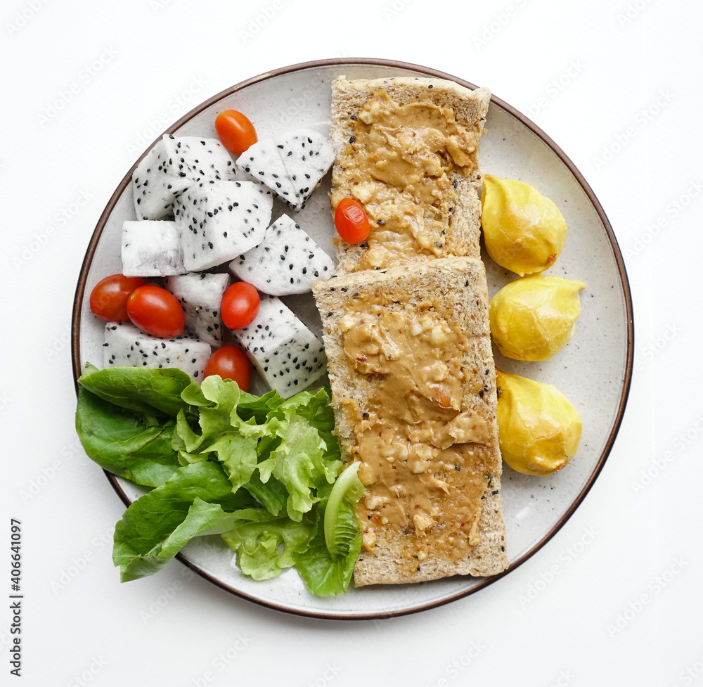 Healthy dish, Peanut butter sandwich with dragon fruits, cherry tomatoes and vegetables on white background, Diet dish isolated Healthy dish, Peanut butter sandwich with dragon fruits, cherry tomatoes and vegetables on white background, Diet dish isolated