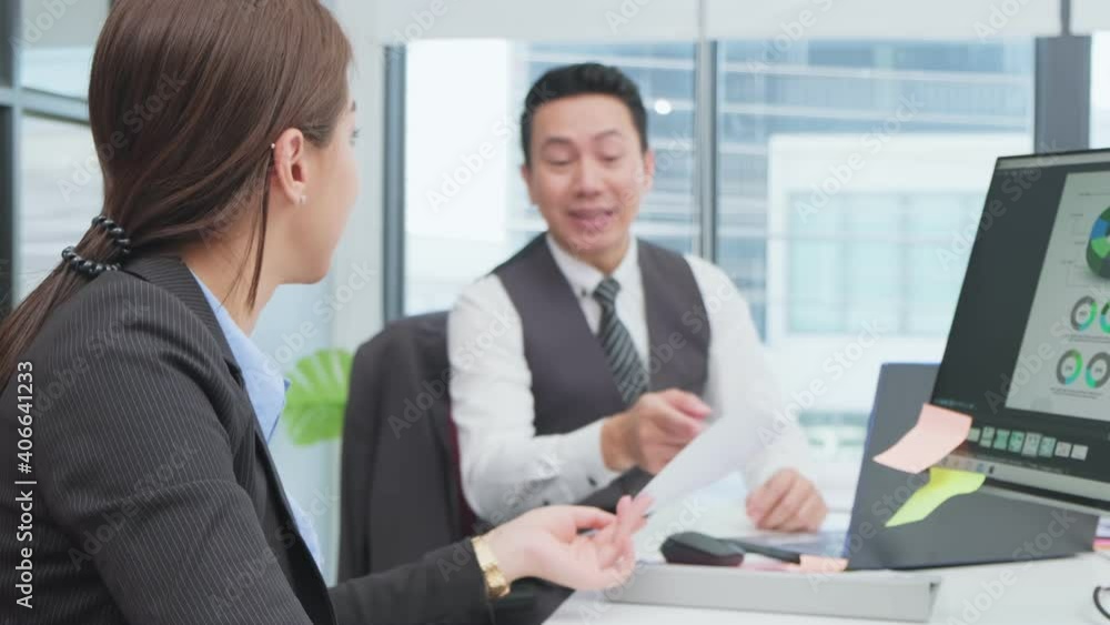 Asian businessman manager assigning a job to his office worker. Asian businessman manager assigning a job to his office worker.