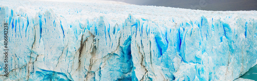 Panorama of rugged glacier cracked edge Perito Moreno (Glaciar Perito Moreno) on sunny summer day. Patagonia, Argentina, Andes