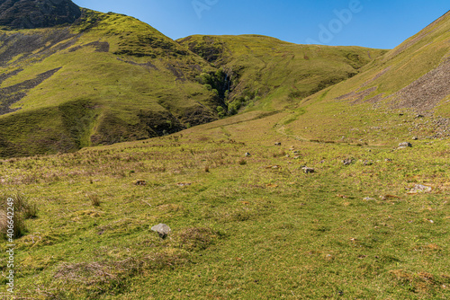 Yorkshire Dales landscape with the Howgill Fells and Cautley Spout in the background, near Low Haygarth, Cumbria, England, UK photo