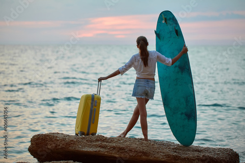 Photography Woman enjoying sunset over ocean alone