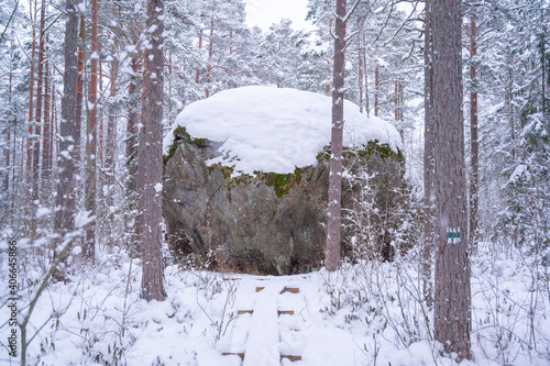 snow covered hughe rock photo