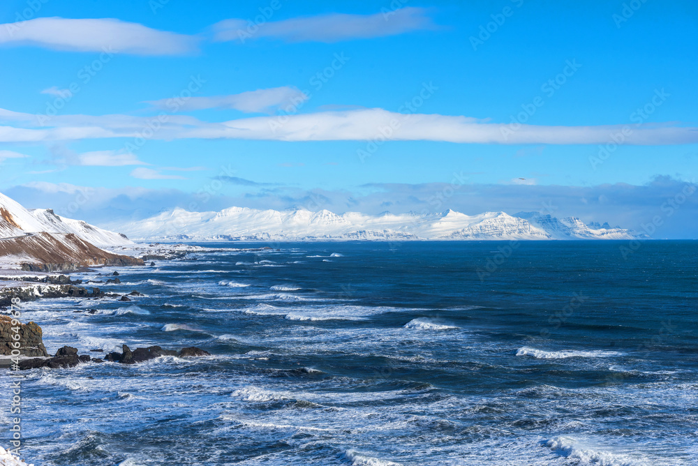 Beautiful winter view of picturesque Atlantic Ocean in Iceland. A waves of the Atlantic Ocean hit the coast of Iceland. The coast of Atlantic Ocean in winter.