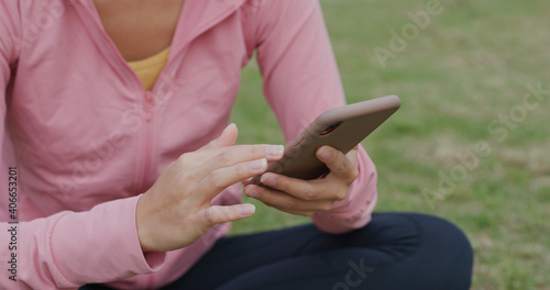 Woman use of smart phone at park