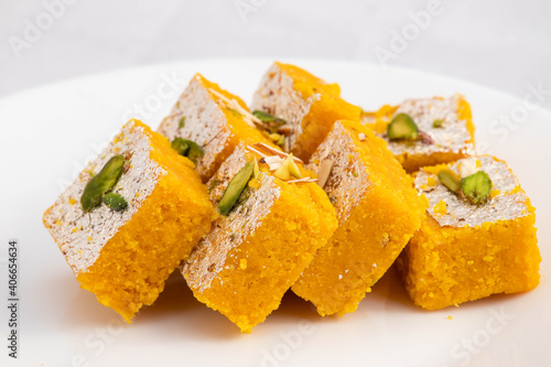 Moong Dal Burfi Or Meetha Mung Daal Barfi Barfee Is Delicious Indian Mithai Enjoyed On Festivals Like Diwali Holi Navaratri Puja And Offered To God During Pooja. White Background With Space For Text