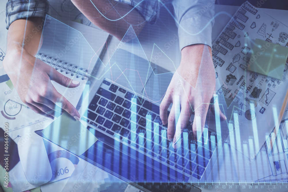 Double exposure of man and woman working together and forex graph hologram drawing. Financial analysis concept. Computer background. Top View. Double exposure of man and woman working together and forex graph hologram drawing. Financial analysis concept. Computer background. Top View.