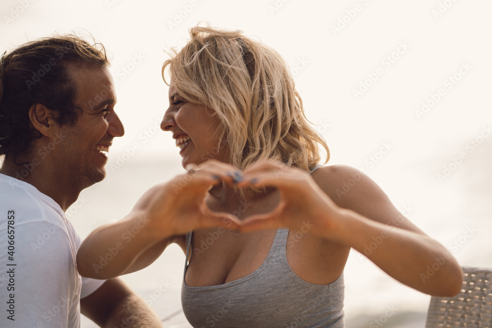 Close-up cropped portrait of nice couple in heart shape isolated. Valentine day celebration. Close-up cropped portrait of nice couple in heart shape isolated. Valentine day celebration.