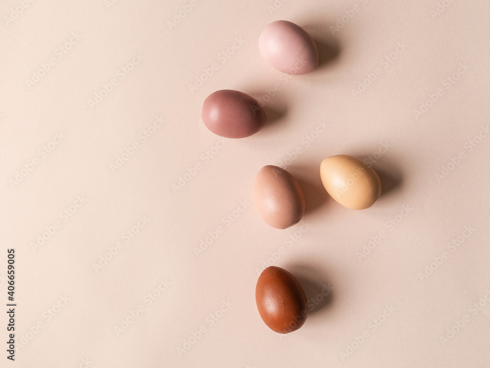 Set of Easter eggs varios colored on beige background Set of Easter eggs varios colored on beige background