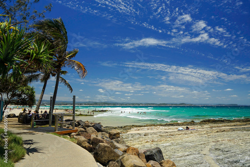 Beach with palm trees and sea. Coolangatta, Queensland, Australia.
