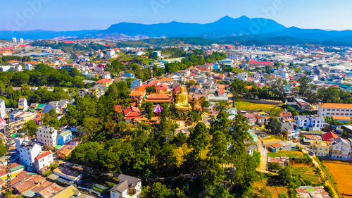 Aerial view of The Golden Buddha statue or Thien vien Van Hanh in Dalat city in Vietnam. © CravenA