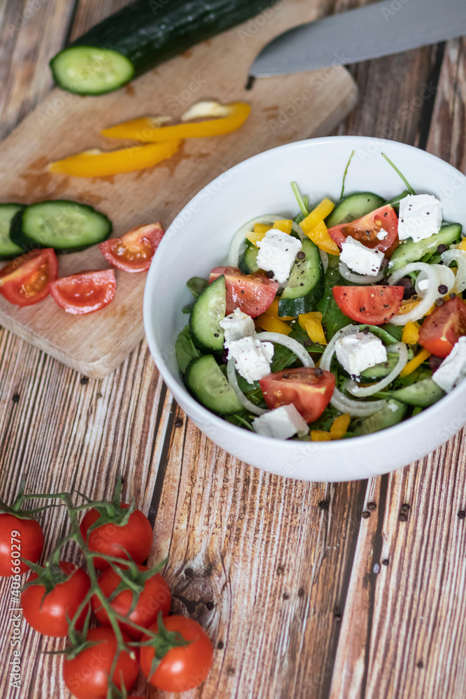 Green vegan salad made from a mixture of green leaves and vegetables. Green vegan salad made from a mixture of green leaves and vegetables.