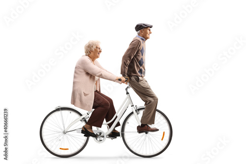 Elderly woman riding an elderly on a bicycle
