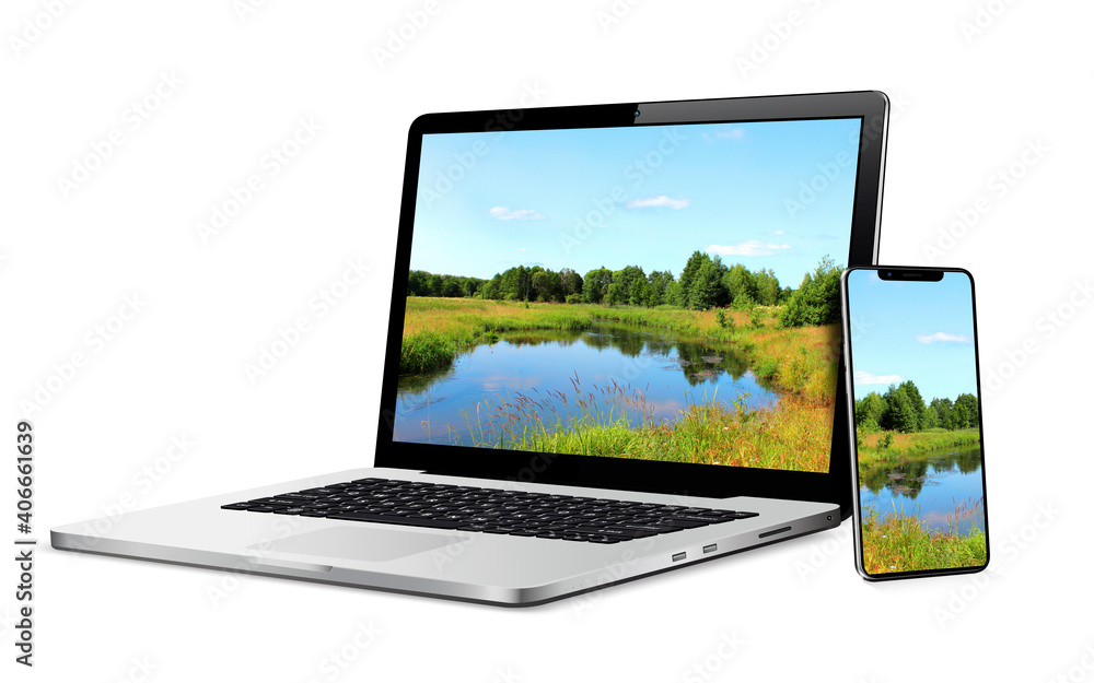 Laptop and phone with landscape wallpaper on screen Laptop and phone with landscape wallpaper on screen