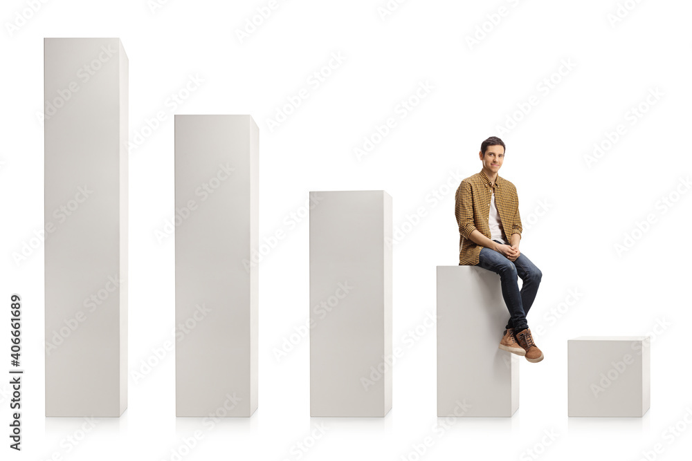 Young casual man sitting on a column from a chart and smiling Young casual man sitting on a column from a chart and smiling