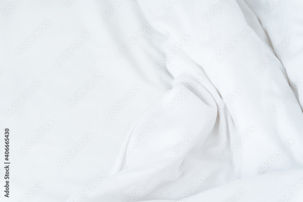 White crumpled sheet wavy mock up. Morning bed. Fabric textile texture. White minimalistic background.