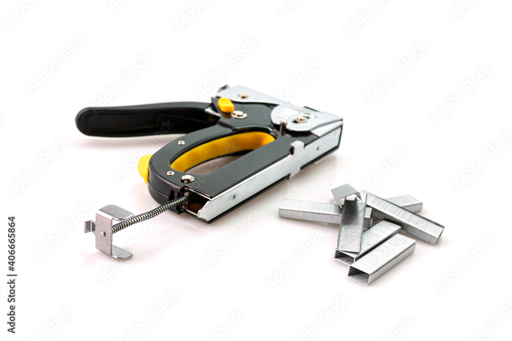 Construction stapler and staples isolated on white background Construction stapler and staples isolated on white background